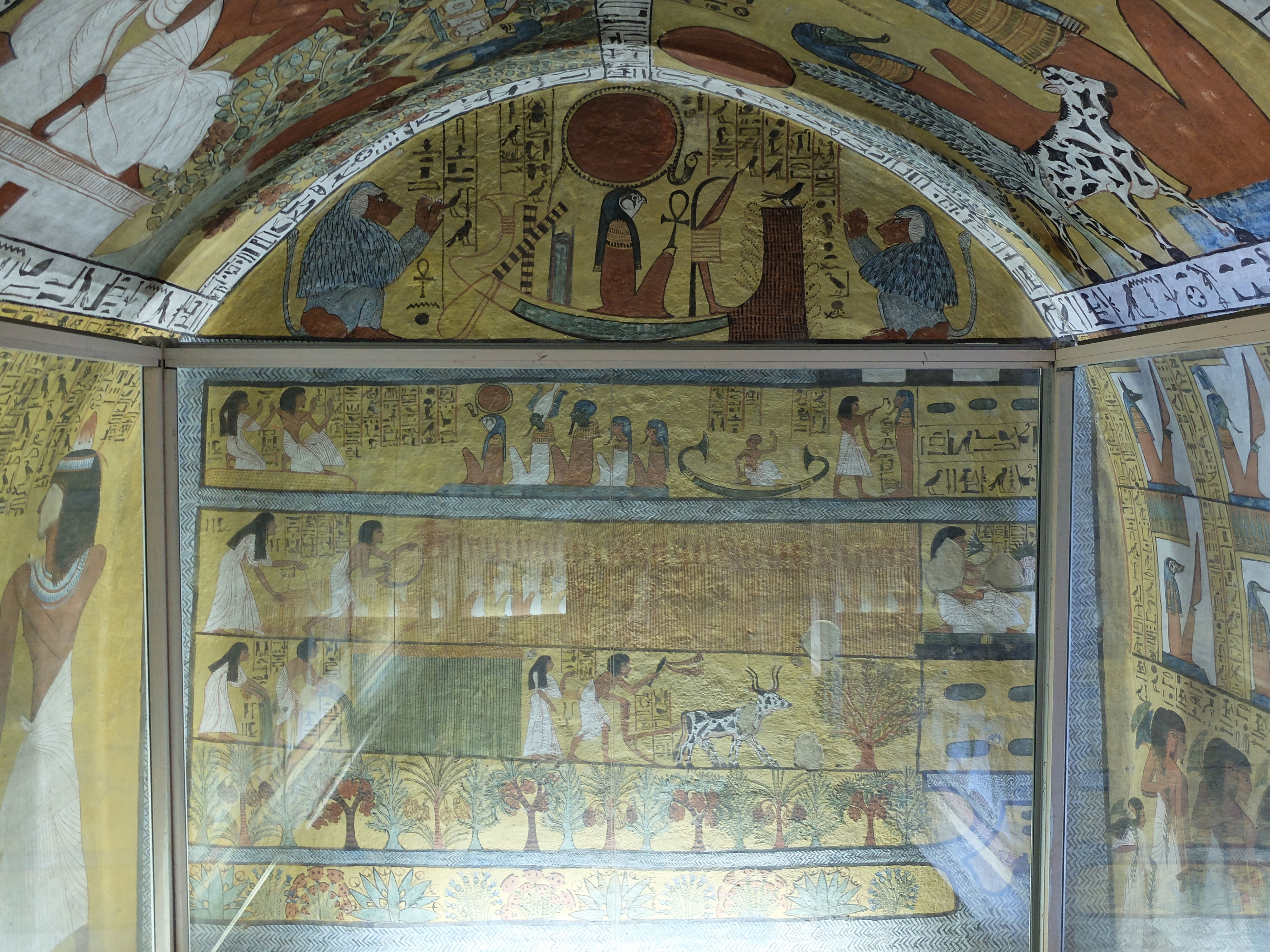Ancient Egyptian wall painting from the Tomb of Sennedjem, c. 1290 BCE. Figures in profile engage in agricultural and ritual activities amid vivid color, evoking the deep historical span of human civilization.