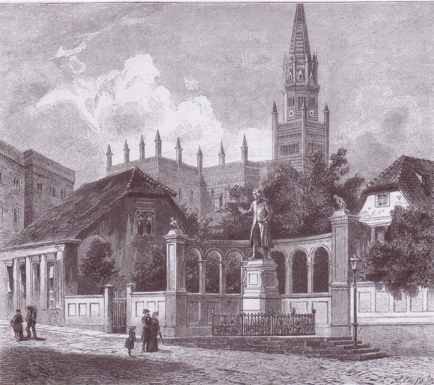 A black and white artwork depicting a European cathedral with a fountain and tree, surrounded by buildings on a cobblestone street in an urban setting.