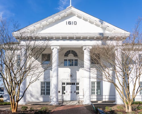 Photograph of the columns of a neoclassical courthouse.