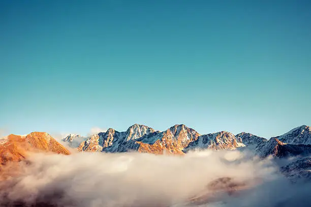 Photograph of a wide horizon where sky meets distant mountains.